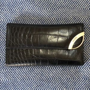Prune black leather wallet with gold hardware